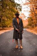 Marquis Simpson stands in road on a fall day.