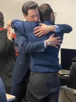 Members of the Utica Mock Trial team share an emotional moment at the 2023 regionals.